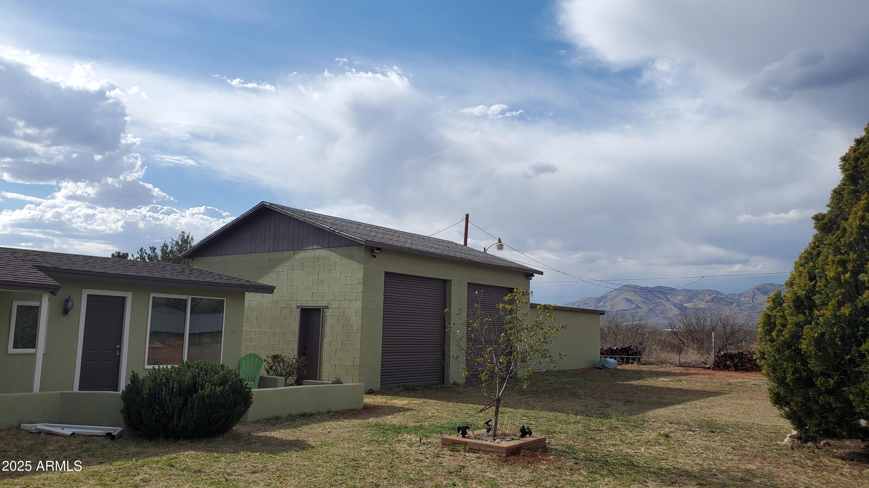 1005 West Purdy Lane Bisbee, AZ 85603 - Photo 23 of 23 a front view of a house with garden