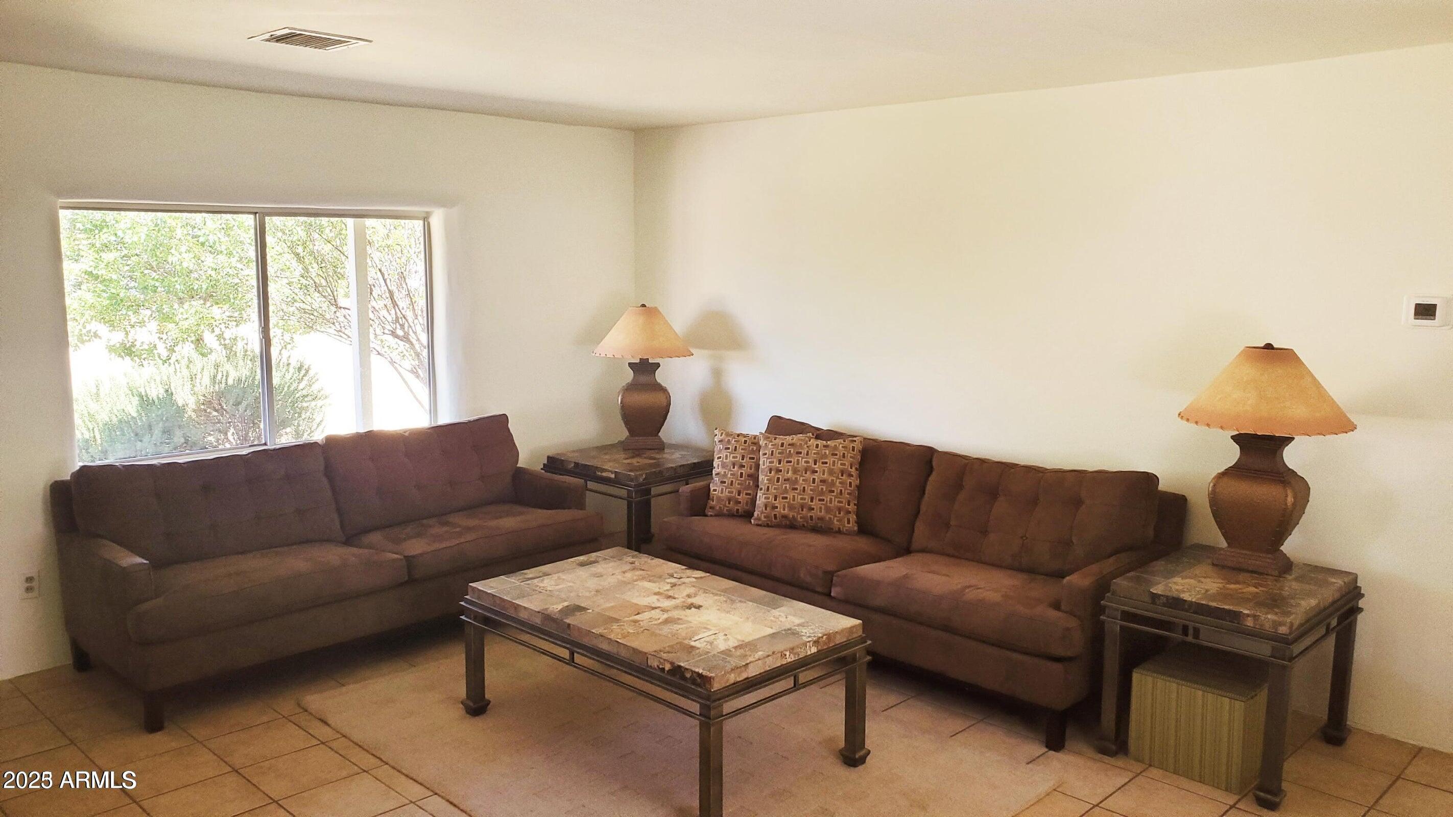 1005 West Purdy Lane Bisbee, AZ 85603 - Photo 10 of 23 a living room with furniture and a window