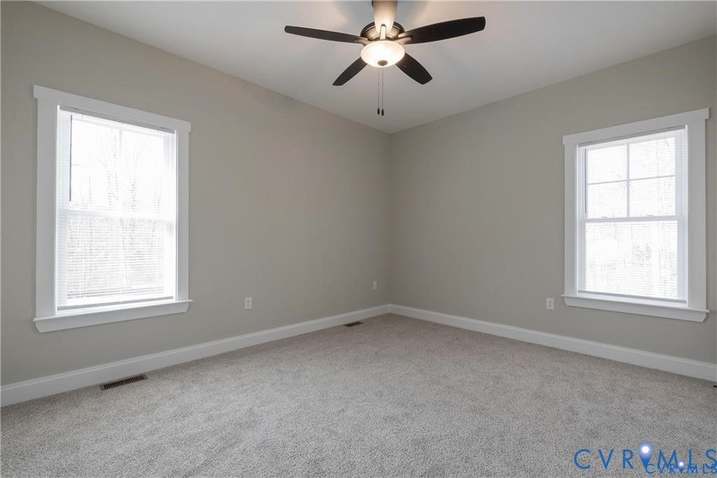 2223 Ridge Road Arvonia, VA 23004 - Photo 26 of 32 Room featuring two windows with white trim, light
