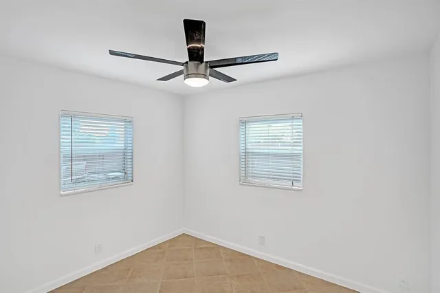 a view of empty room with windows