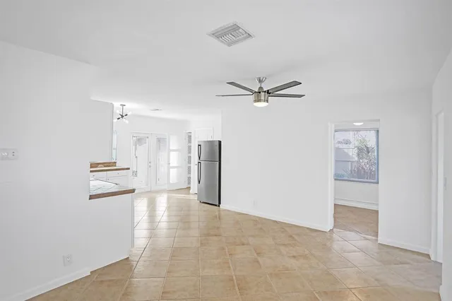 a view of a hallway with a window