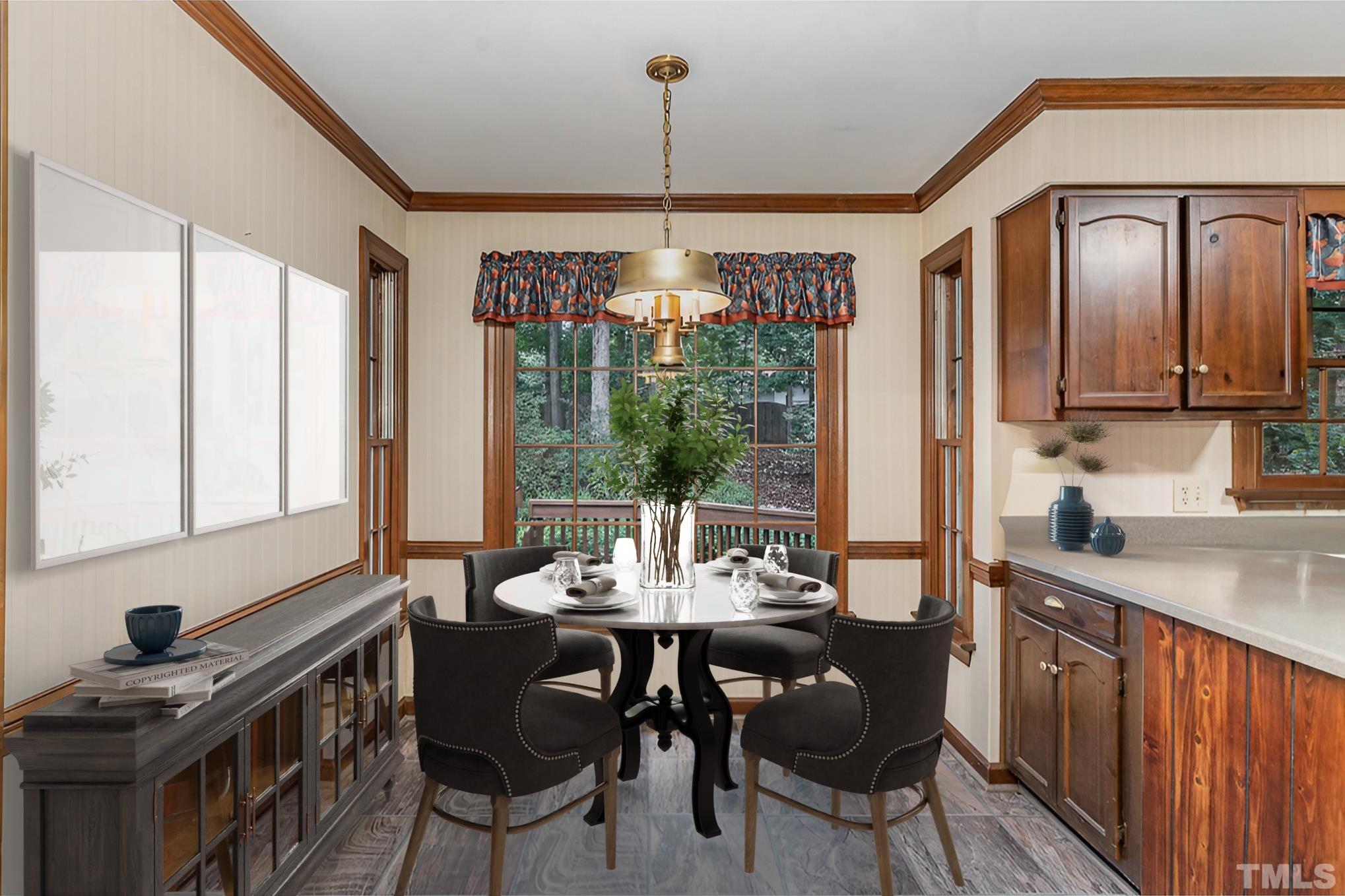 4909 Springwood Drive Raleigh, NC 27613 - Photo 16 of 59 a view of a dining room with furniture window and outside view