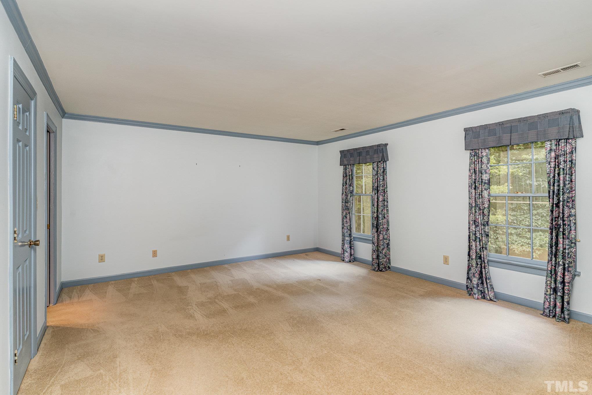 4909 Springwood Drive Raleigh, NC 27613 - Photo 30 of 59 an empty room with sliding door