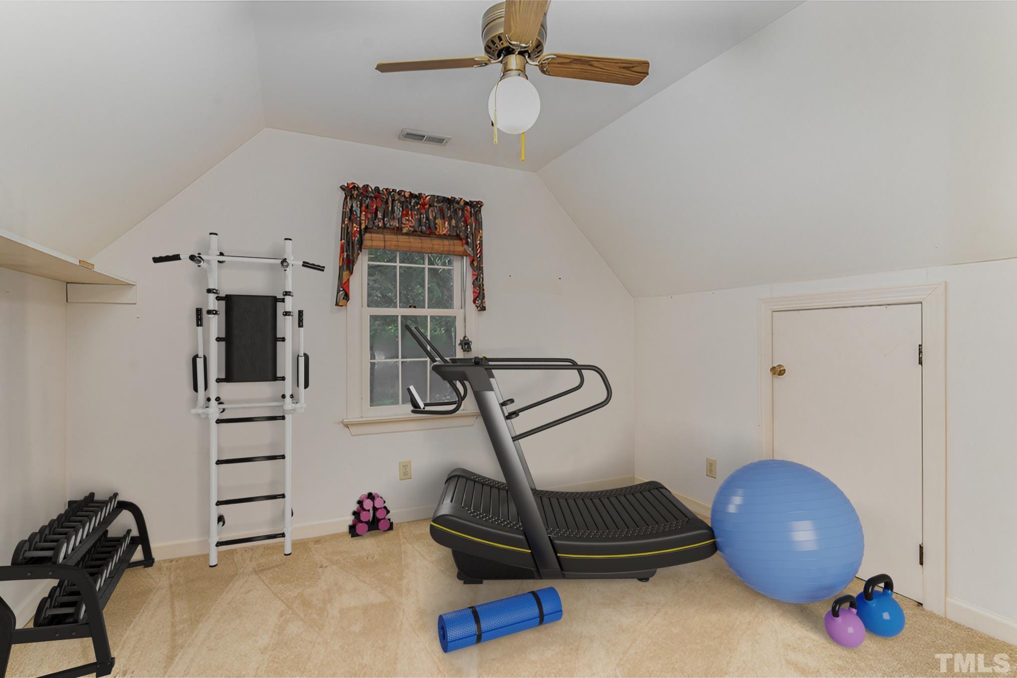 4909 Springwood Drive Raleigh, NC 27613 - Photo 45 of 59 a view of a room with gym equipment