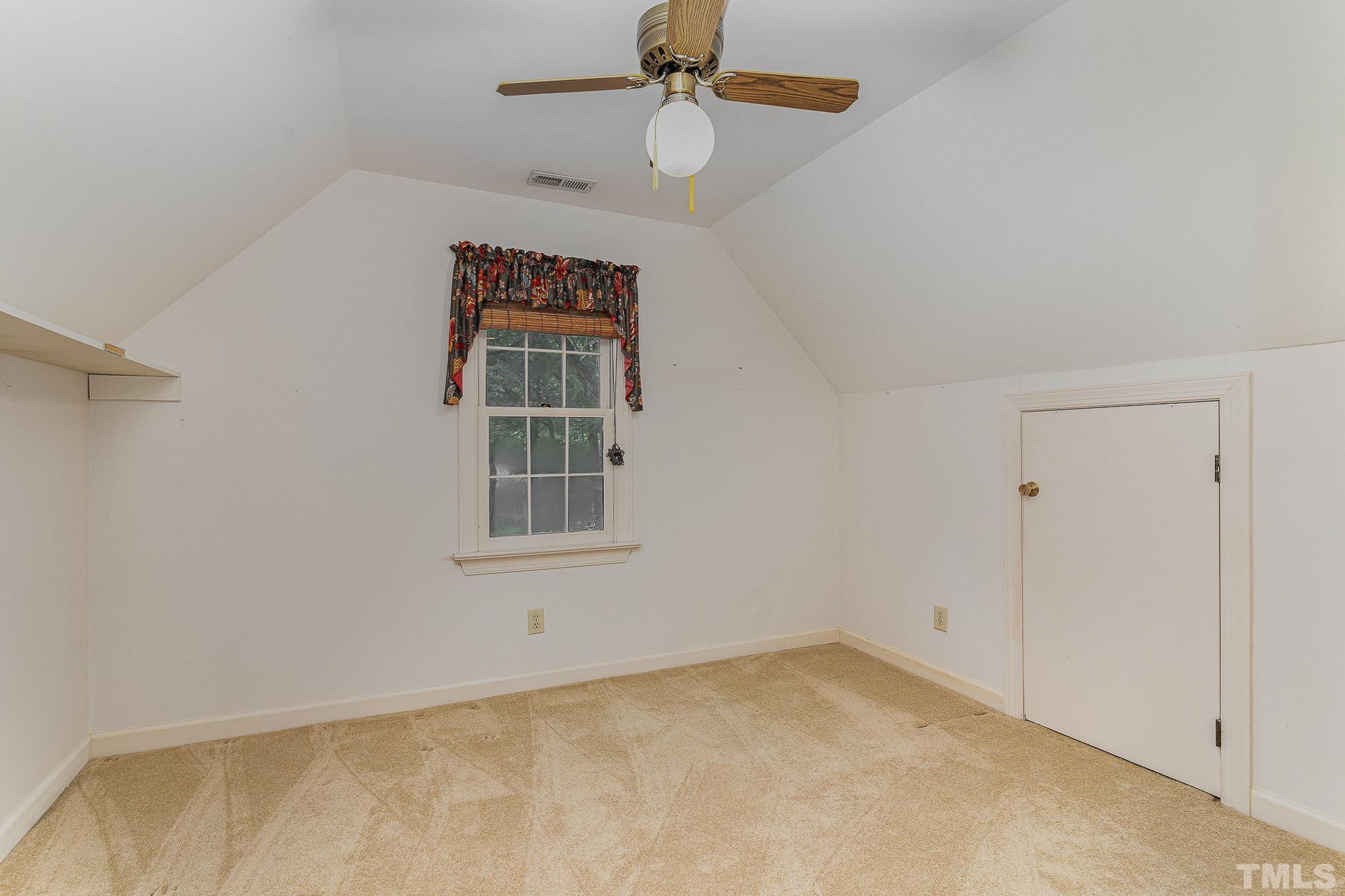 4909 Springwood Drive Raleigh, NC 27613 - Photo 46 of 59 an empty room with windows
