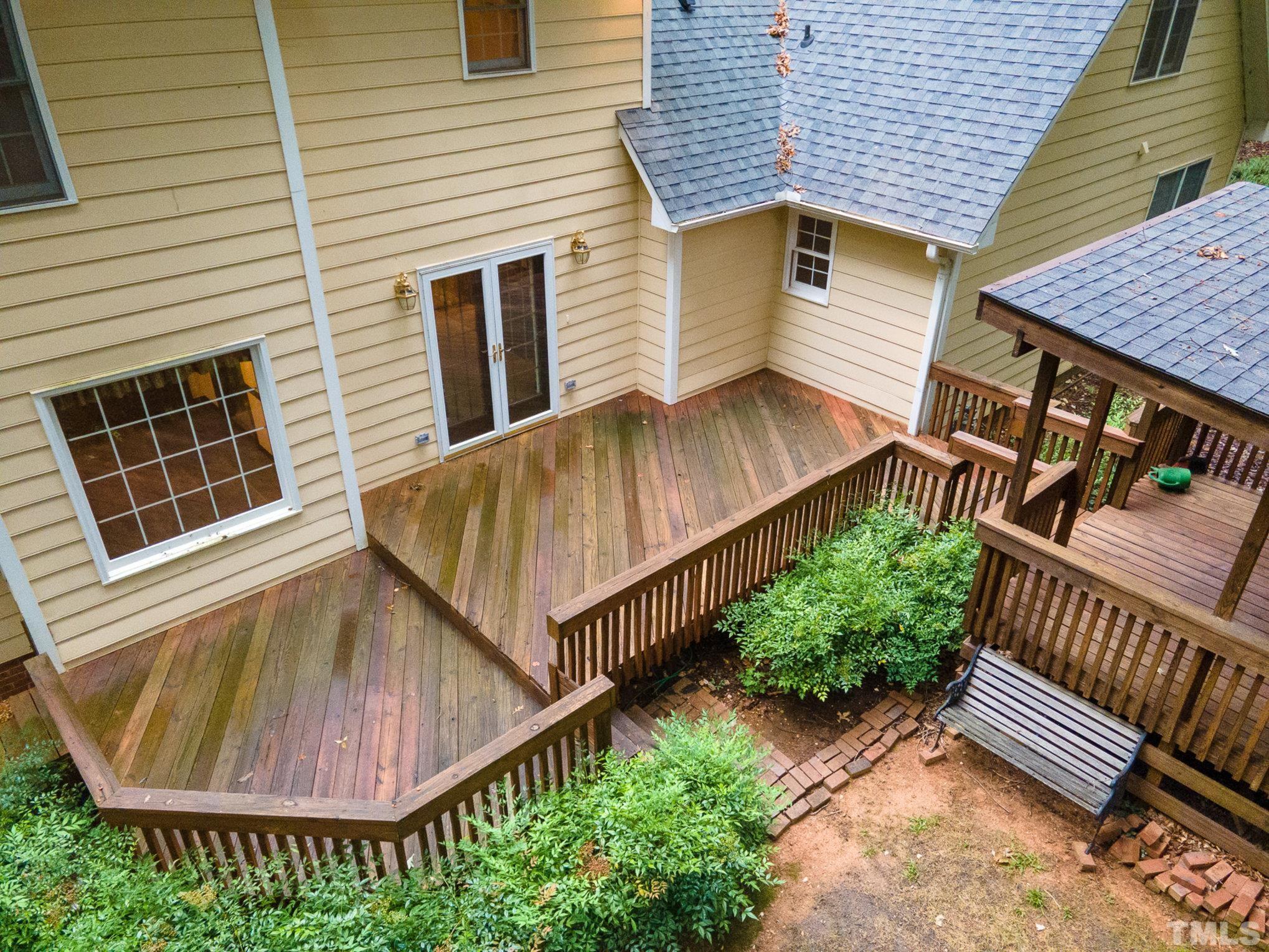 4909 Springwood Drive Raleigh, NC 27613 - Photo 47 of 59 a view of a house with a yard