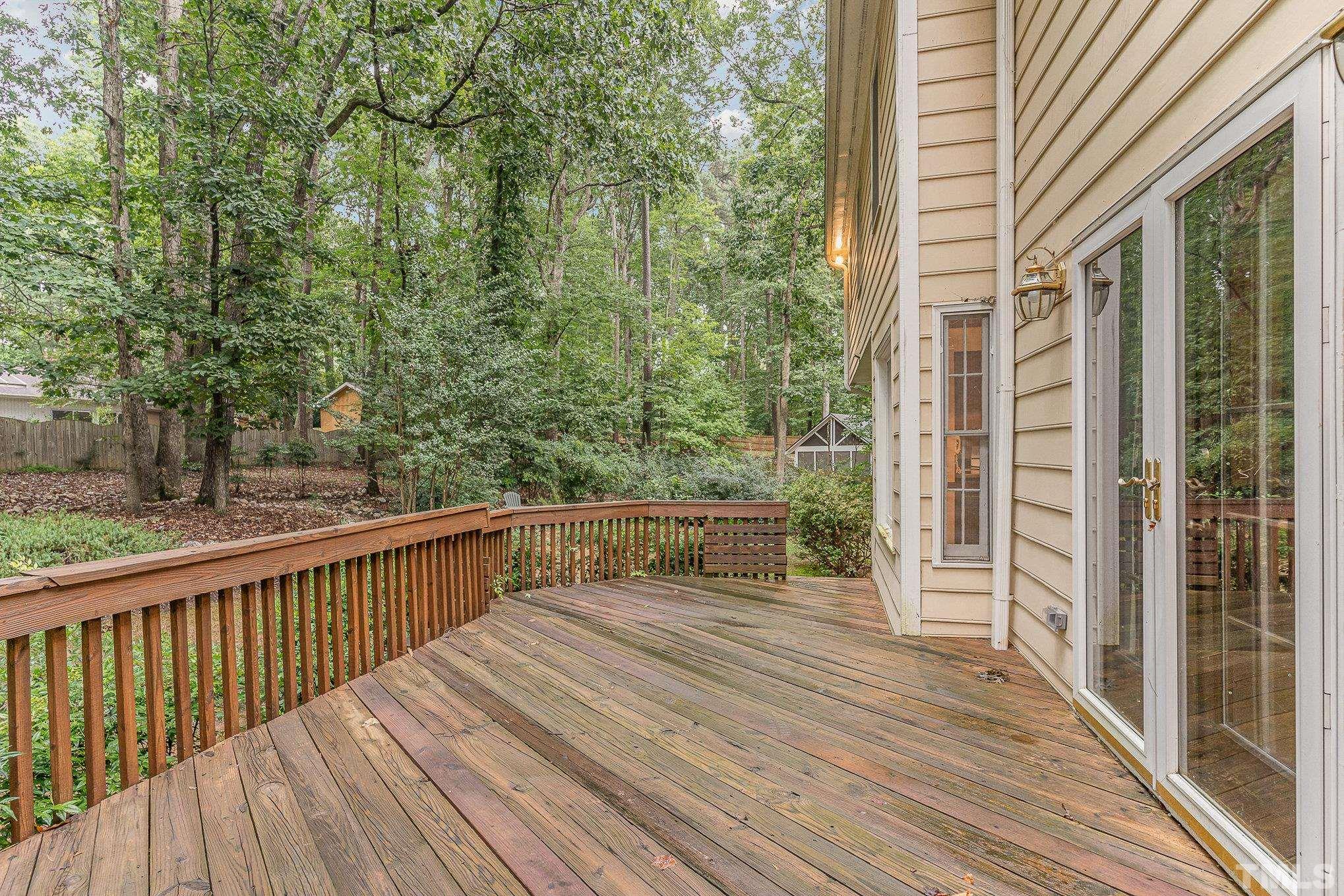 4909 Springwood Drive Raleigh, NC 27613 - Photo 48 of 59 a balcony with wooden floor and fence