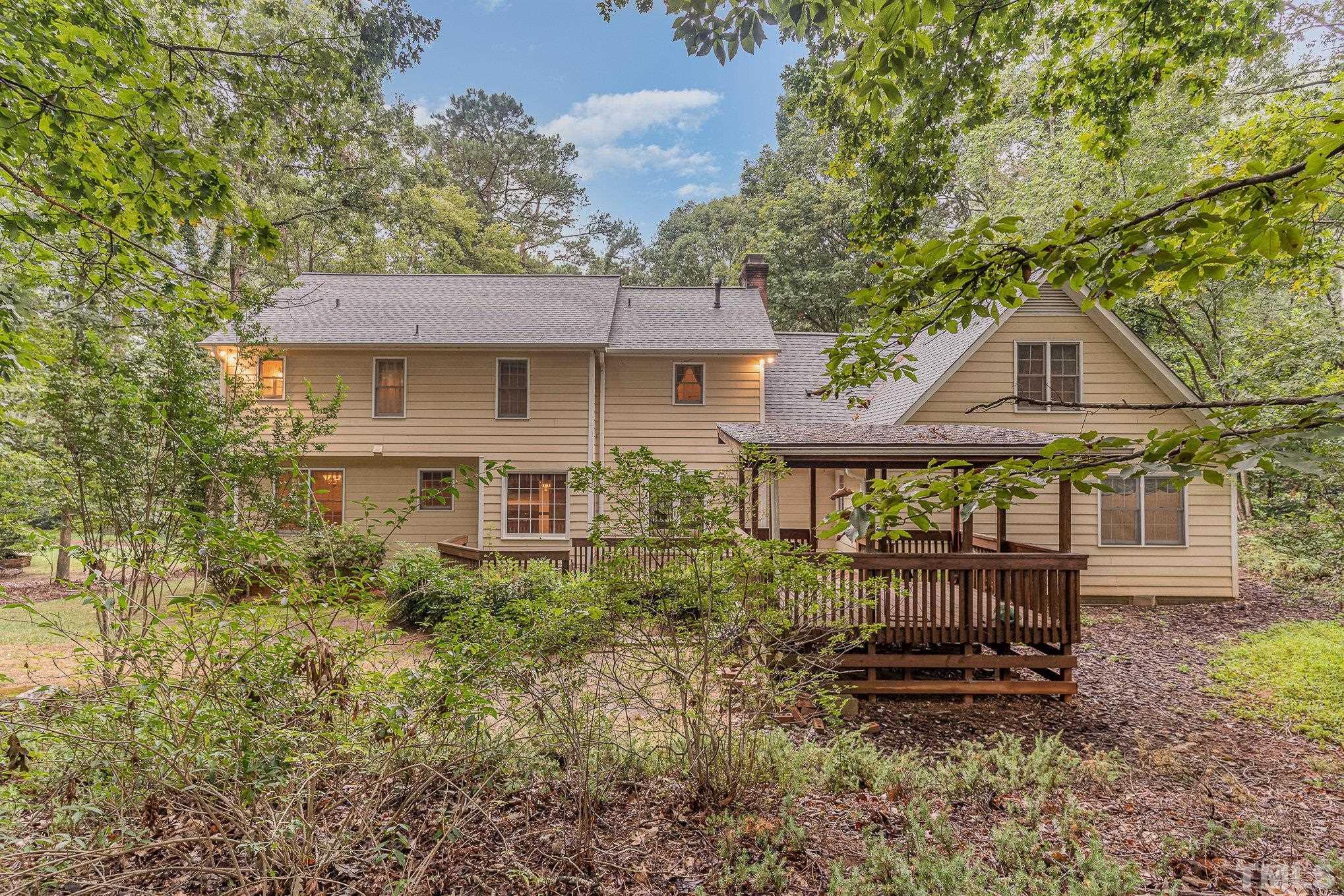 4909 Springwood Drive Raleigh, NC 27613 - Photo 51 of 59 a front view of a house with a yard