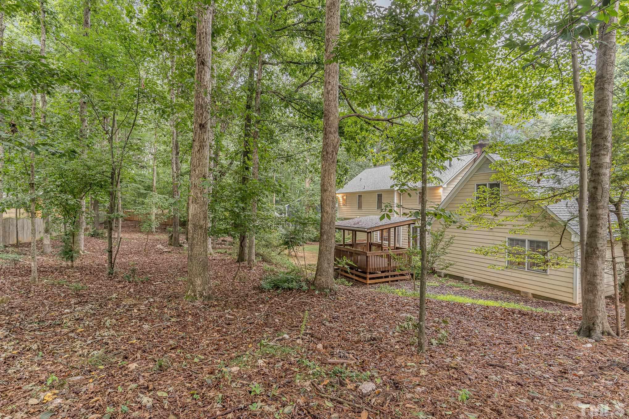 4909 Springwood Drive Raleigh, NC 27613 - Photo 55 of 59 a view of a house with a backyard