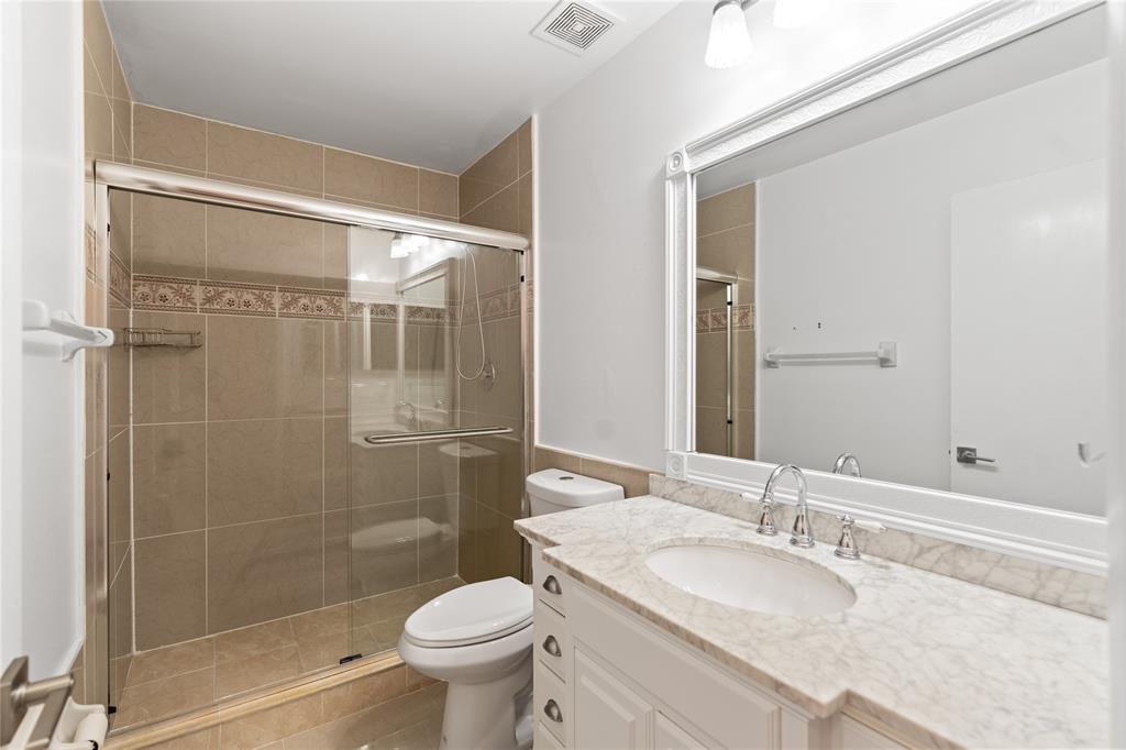 9580 Southwest 2nd Ct., Unit 9580 Pembroke Pines, FL 33025 - Photo 11 of 33 a bathroom with a granite countertop sink toilet and shower