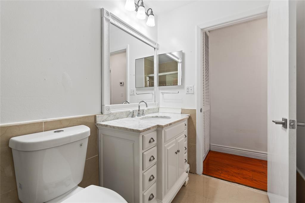 9580 Southwest 2nd Ct., Unit 9580 Pembroke Pines, FL 33025 - Photo 12 of 33 a bathroom with a sink a toilet and shower