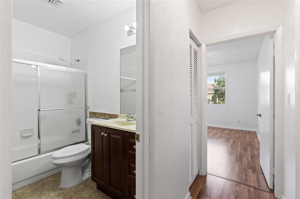 9580 Southwest 2nd Ct., Unit 9580 Pembroke Pines, FL 33025 - Photo 17 of 33 a bathroom with a toilet a sink and shower