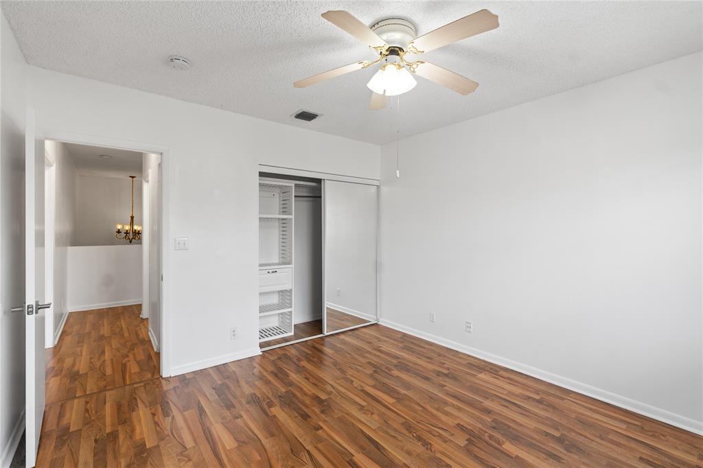 9580 Southwest 2nd Ct., Unit 9580 Pembroke Pines, FL 33025 - Photo 20 of 33 a view of empty room with wooden floor and fan