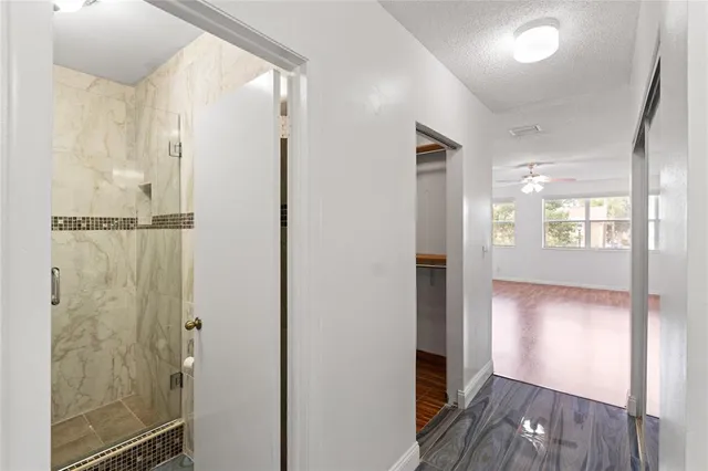 a bathroom with a shower and a toilet