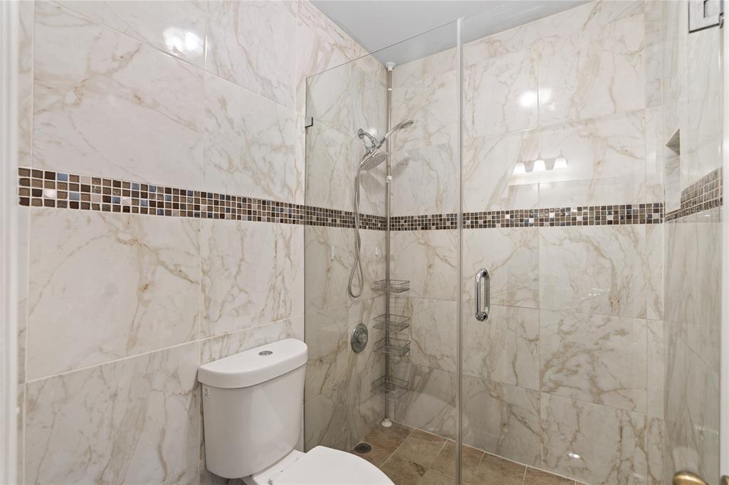 9580 Southwest 2nd Ct., Unit 9580 Pembroke Pines, FL 33025 - Photo 27 of 33 a bathroom with a shower and a toilet