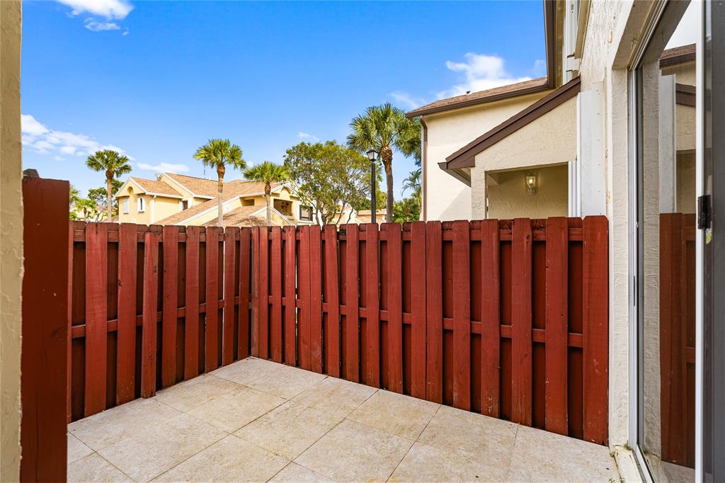 9580 Southwest 2nd Ct., Unit 9580 Pembroke Pines, FL 33025 - Photo 30 of 33 a view of a wooden fence
