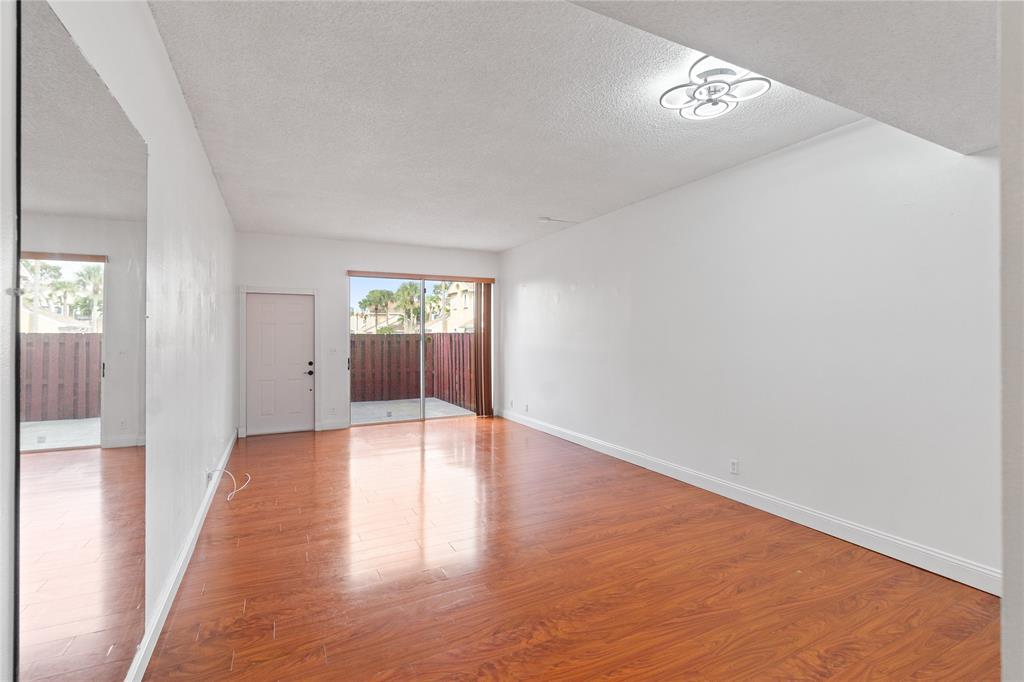 9580 Southwest 2nd Ct., Unit 9580 Pembroke Pines, FL 33025 - Photo 5 of 33 a view of an empty room and window
