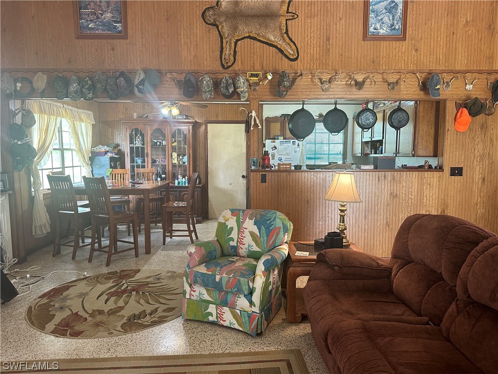 22841 North River Road Alva, FL 33920 - Photo 13 of 23 a living room with furniture and wooden floor