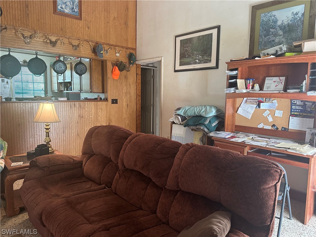 22841 North River Road Alva, FL 33920 - Photo 14 of 23 a living room with furniture and wall paintings