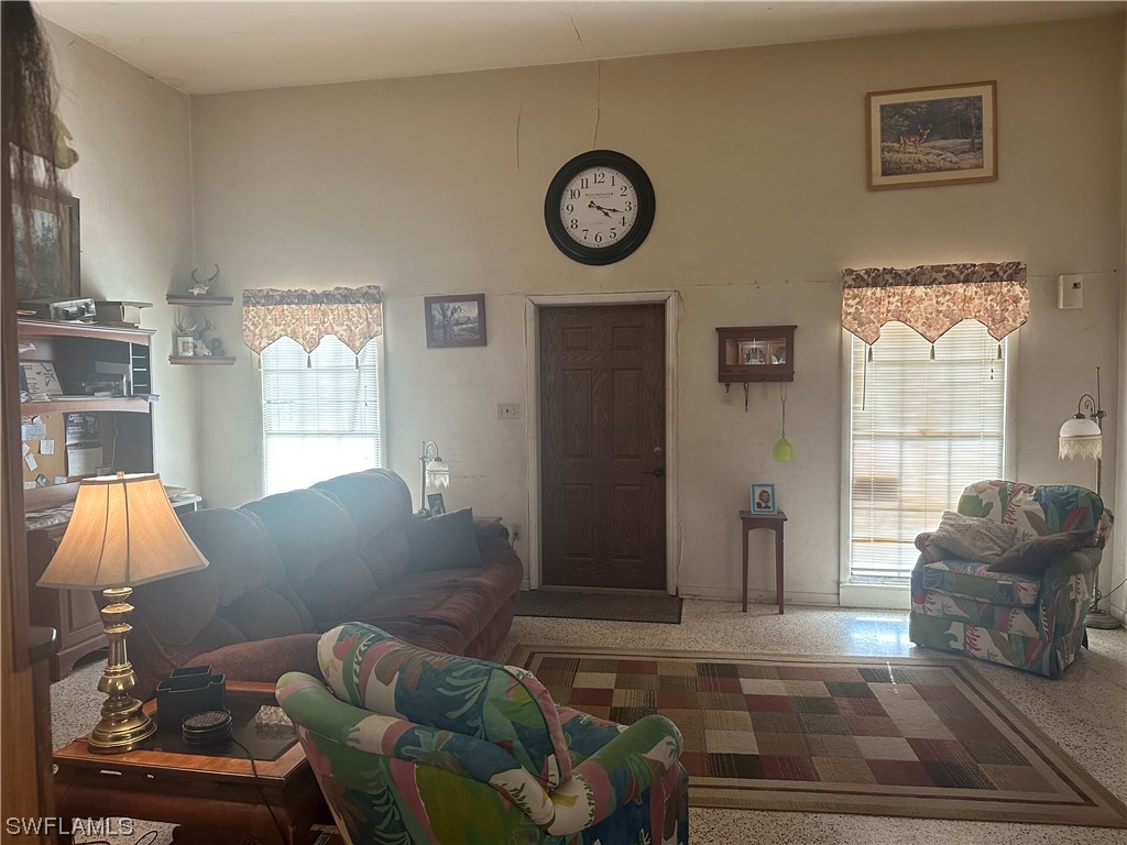 22841 North River Road Alva, FL 33920 - Photo 19 of 23 a living room with furniture and a window