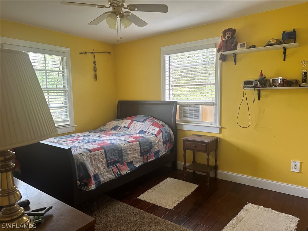 22841 North River Road Alva, FL 33920 - Photo 20 of 23 a bedroom with a bed and a table