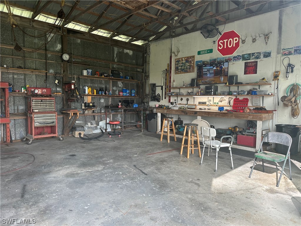 22841 North River Road Alva, FL 33920 - Photo 3 of 23 a outdoor area with lots of furniture and clutter