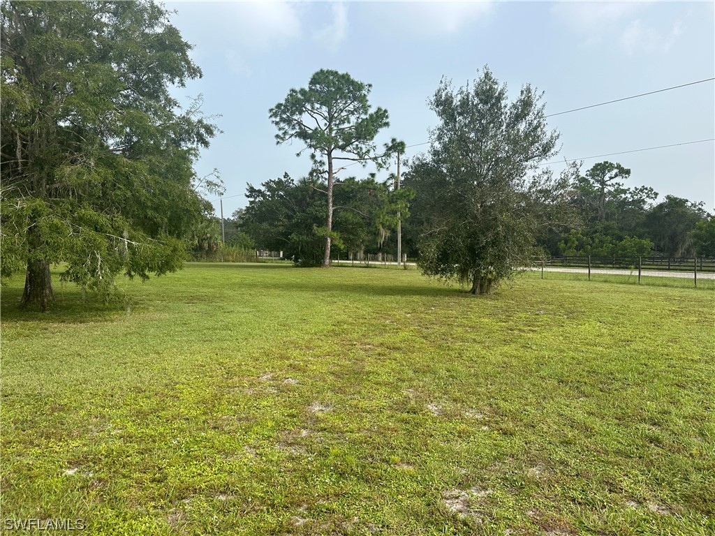 22841 North River Road Alva, FL 33920 - Photo 6 of 23 a view of outdoor space with deck and yard