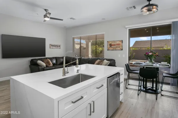 a view of kitchen island a sink and living room