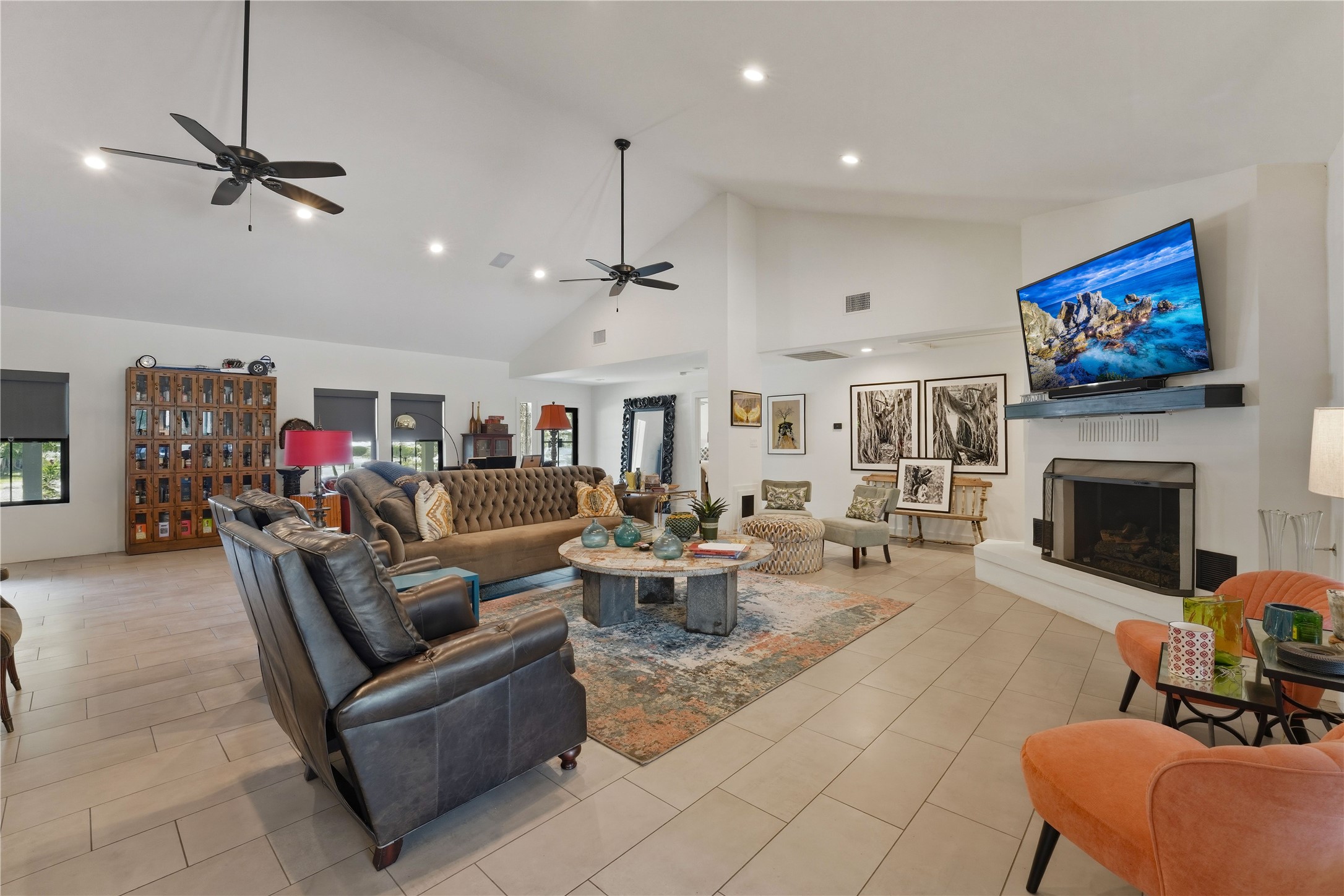 1124 Bowie Street Columbus, TX 78934 - Photo 9 of 28 a living room with furniture a fireplace and a flat screen tv