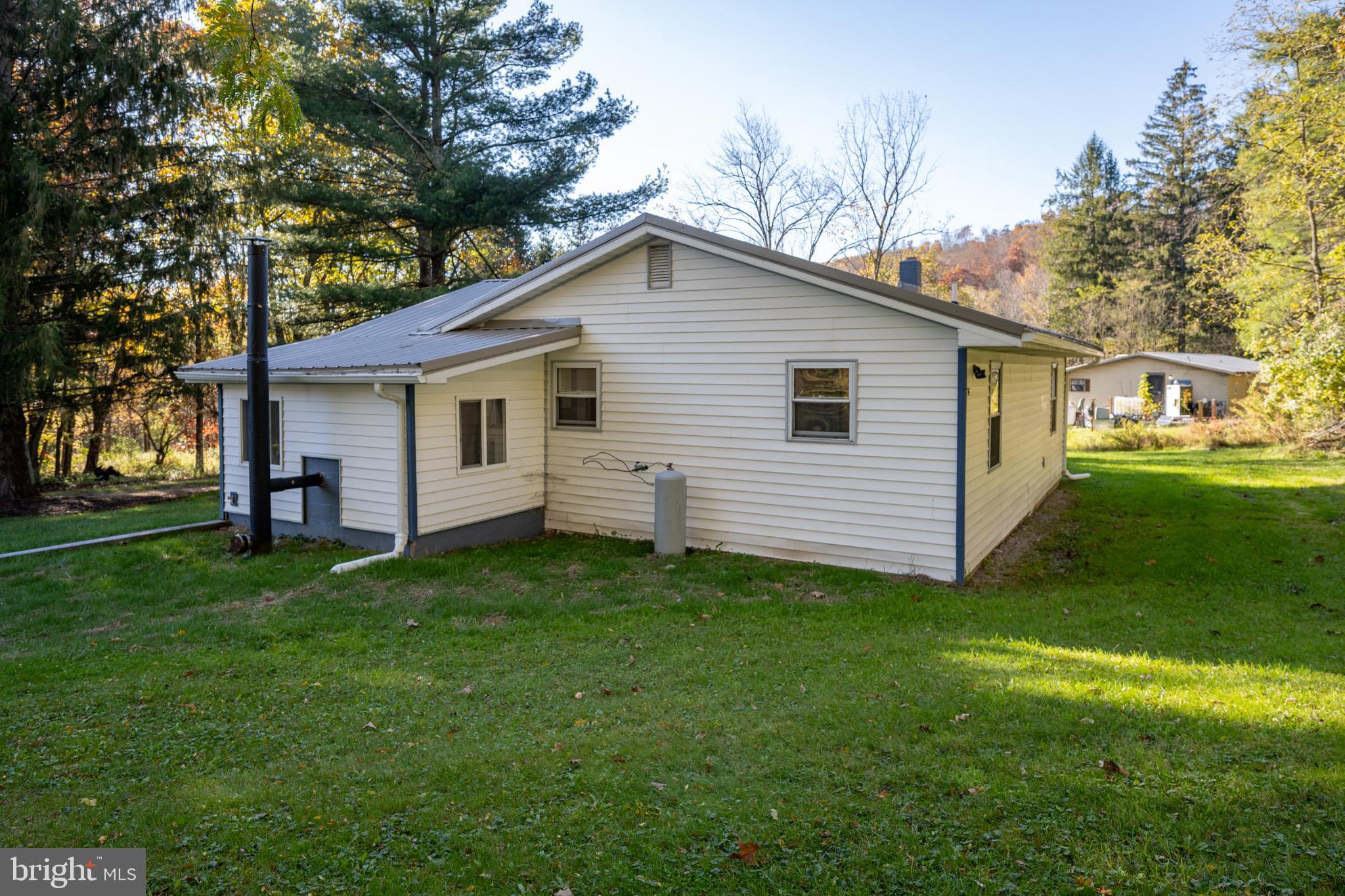 63 Wallman Road Oakland, MD 21550 - Photo 14 of 60 a view of a house with a backyard