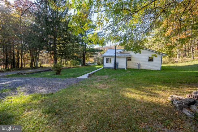 a view of backyard with wooden floor and fence