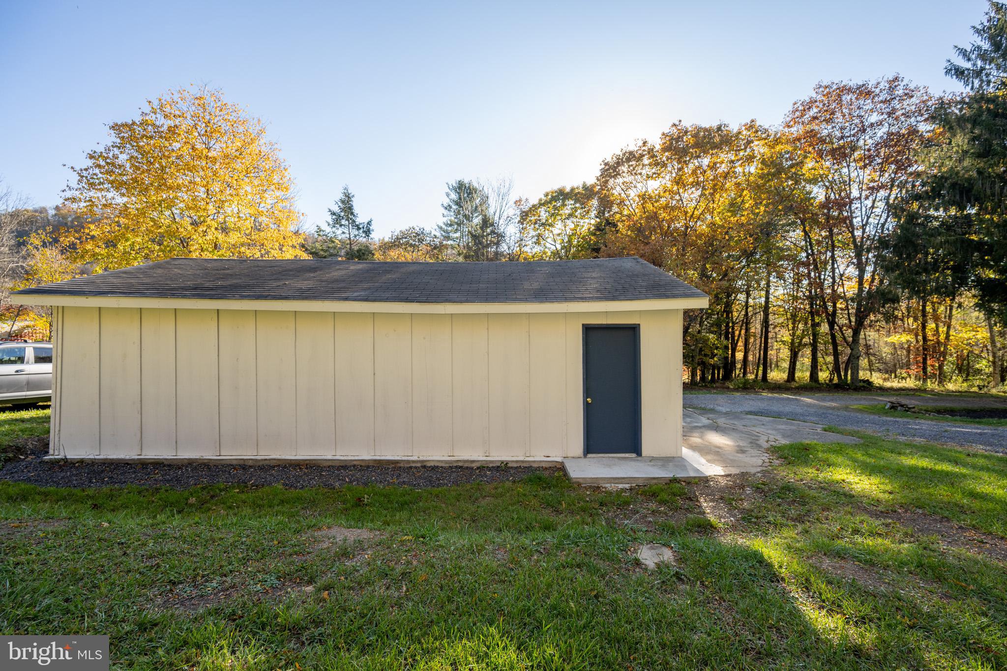 63 Wallman Road Oakland, MD 21550 - Photo 18 of 60 a view of a backyard with large trees