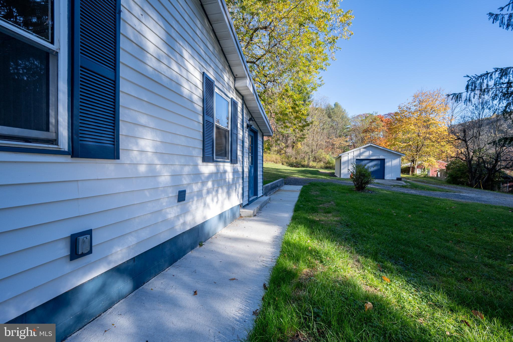 63 Wallman Road Oakland, MD 21550 - Photo 19 of 60 a view of a house with a yard
