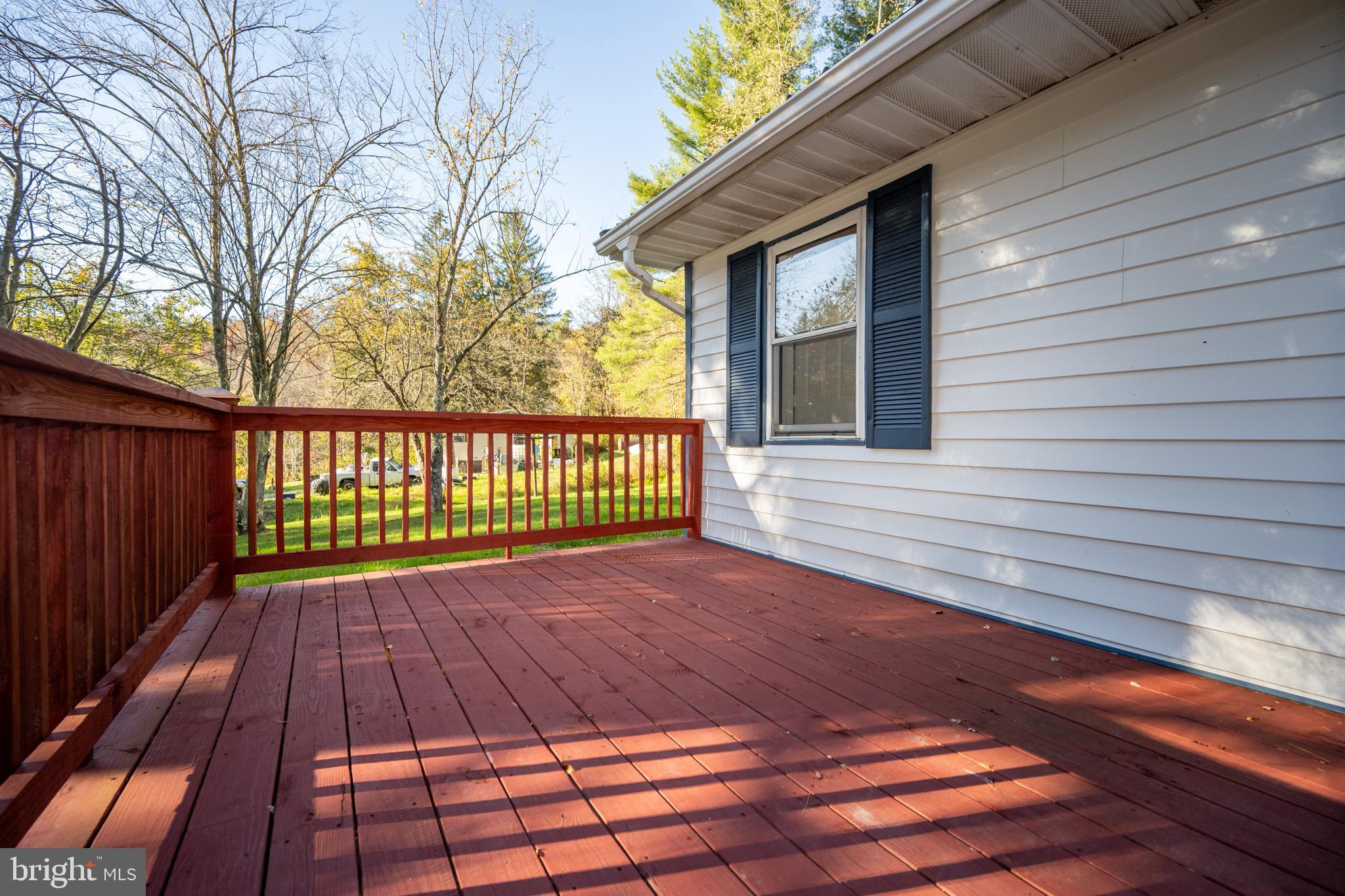 63 Wallman Road Oakland, MD 21550 - Photo 20 of 60 a view of backyard with wooden floor and fence