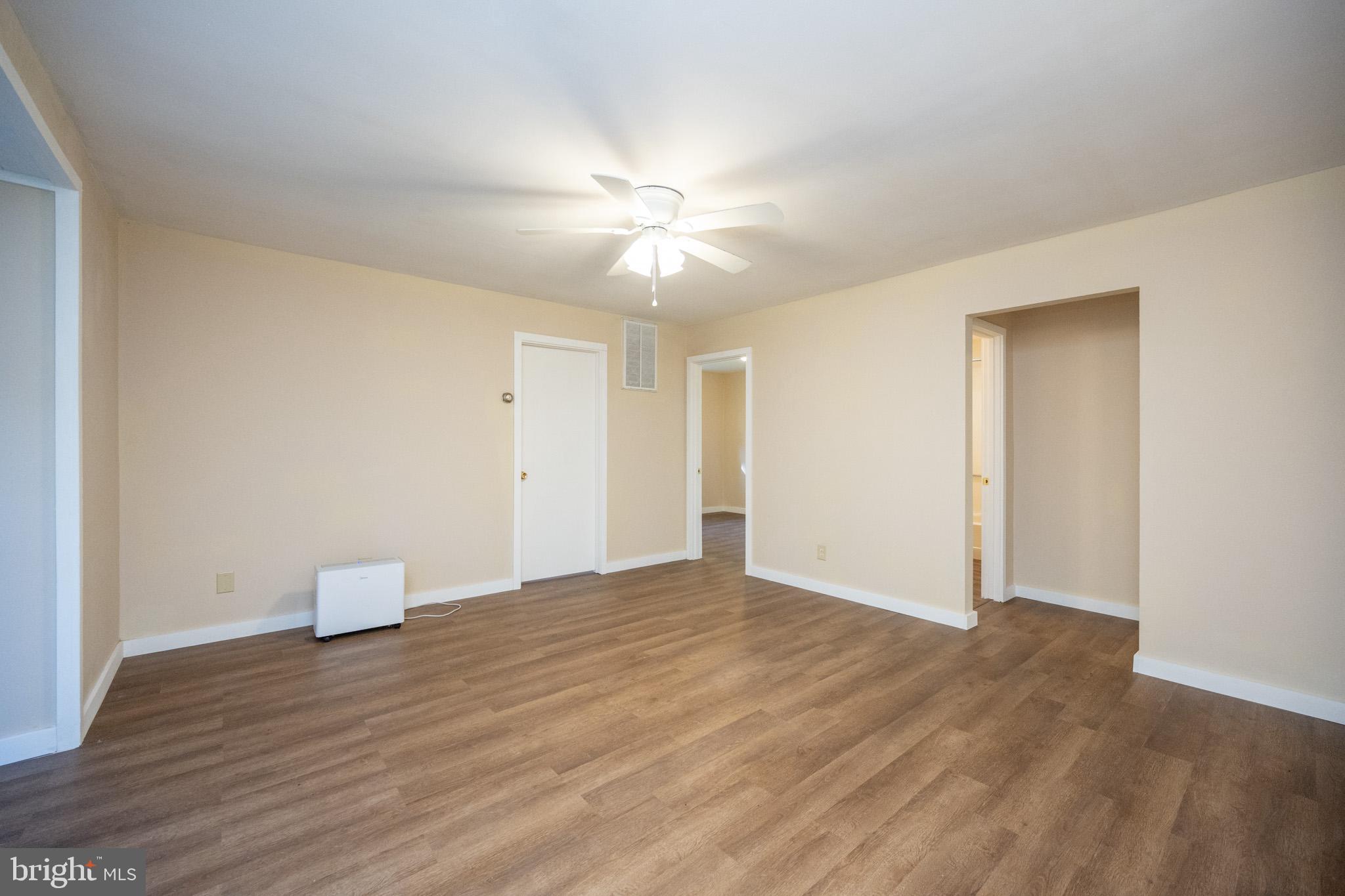 63 Wallman Road Oakland, MD 21550 - Photo 30 of 60 a view of an empty room and window and wooden floor