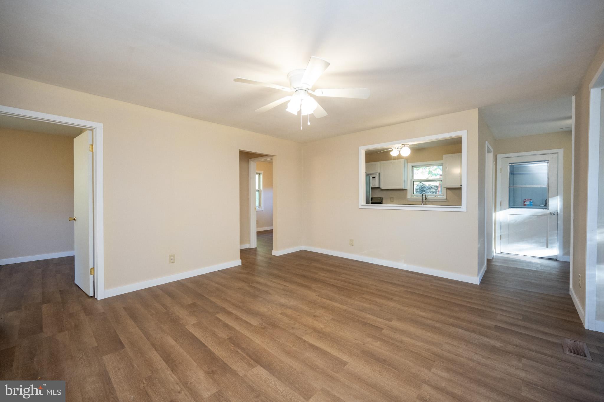 63 Wallman Road Oakland, MD 21550 - Photo 33 of 60 an empty room with wooden floor and windows