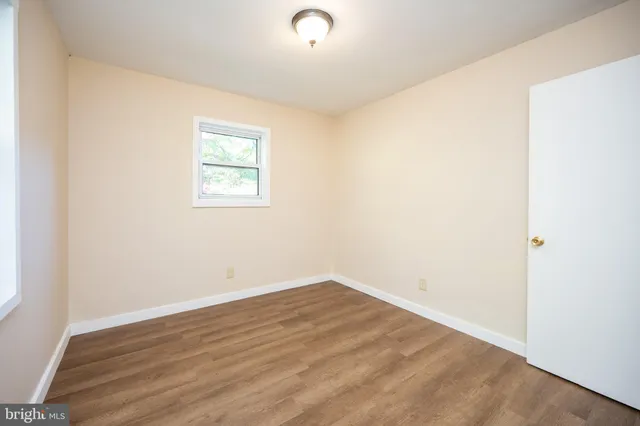 a view of a city with lush green forest