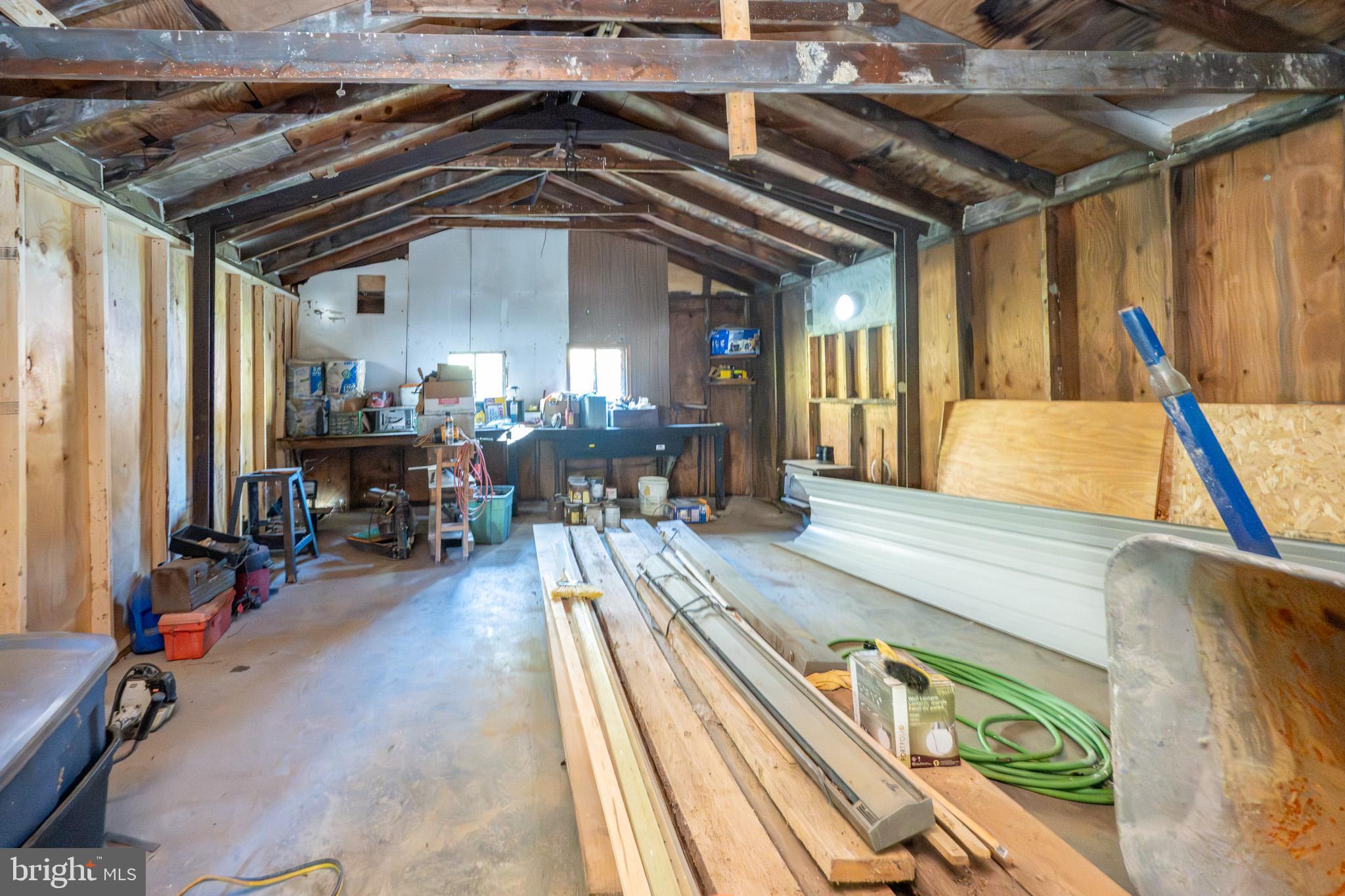 63 Wallman Road Oakland, MD 21550 - Photo 52 of 60 a view of a hallway with wooden floor and furniture