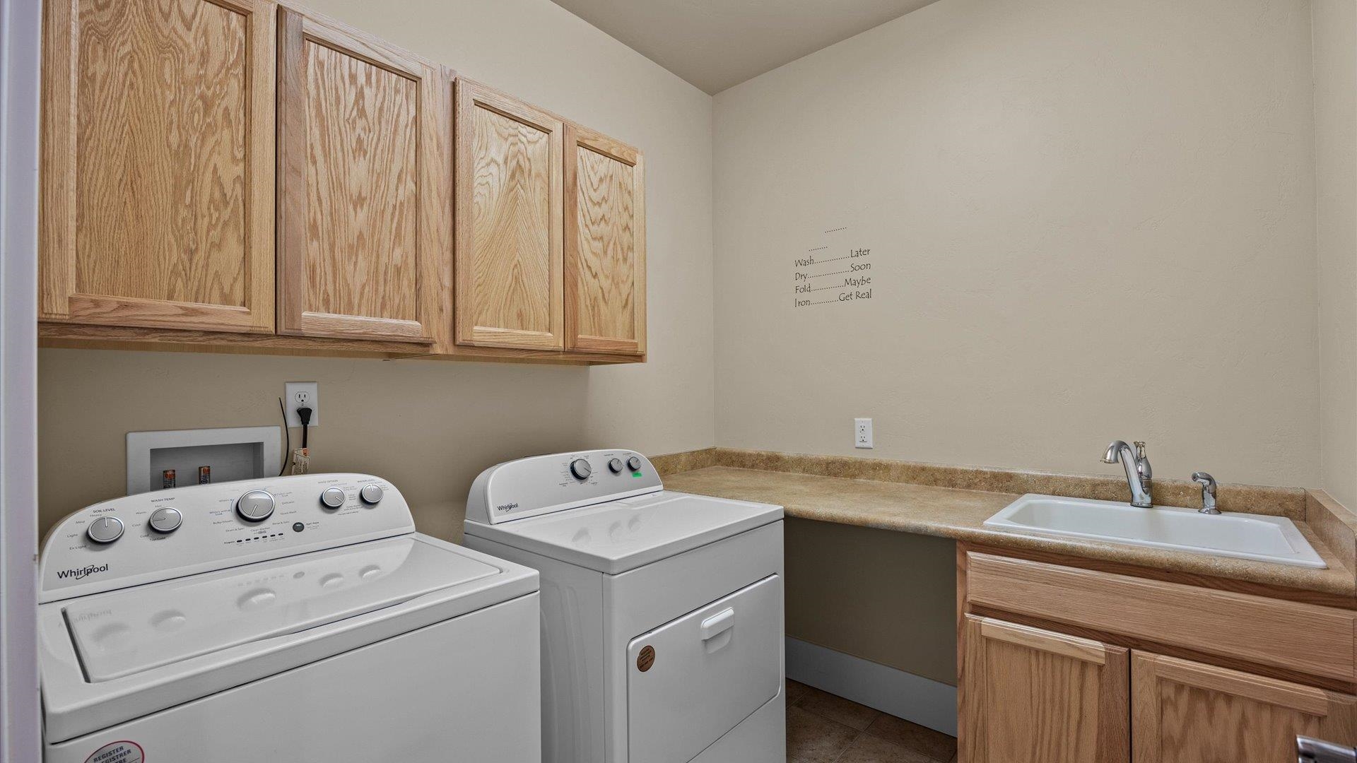 1115 Sunrose Lane Fruita, CO 81521 - Photo 21 of 32 a utility room with dryer and washer
