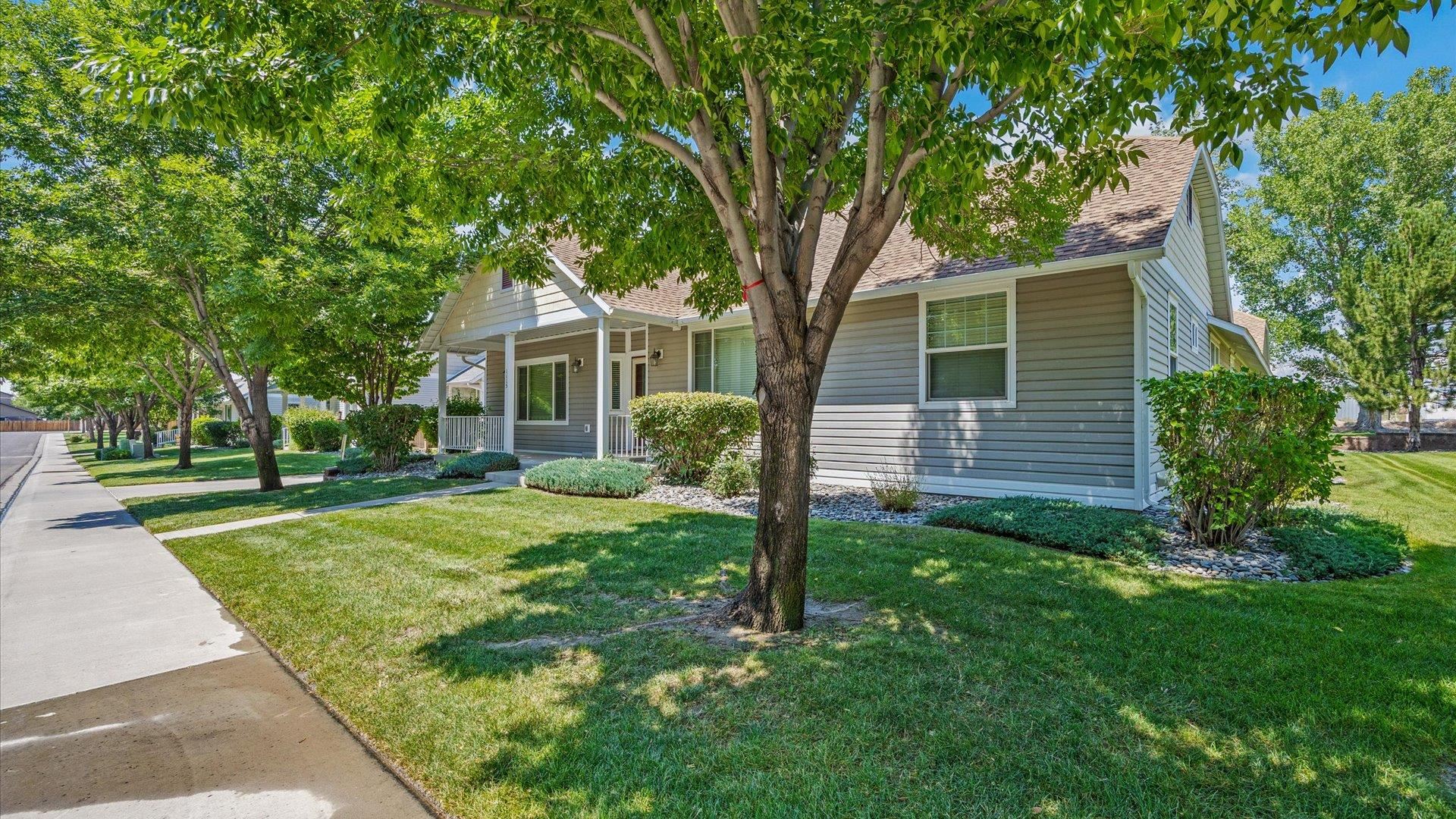 1115 Sunrose Lane Fruita, CO 81521 - Photo 26 of 32 front view of a house with a yard