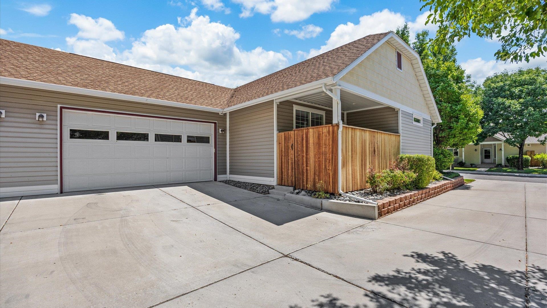 1115 Sunrose Lane Fruita, CO 81521 - Photo 30 of 32 a front view of a house with garage