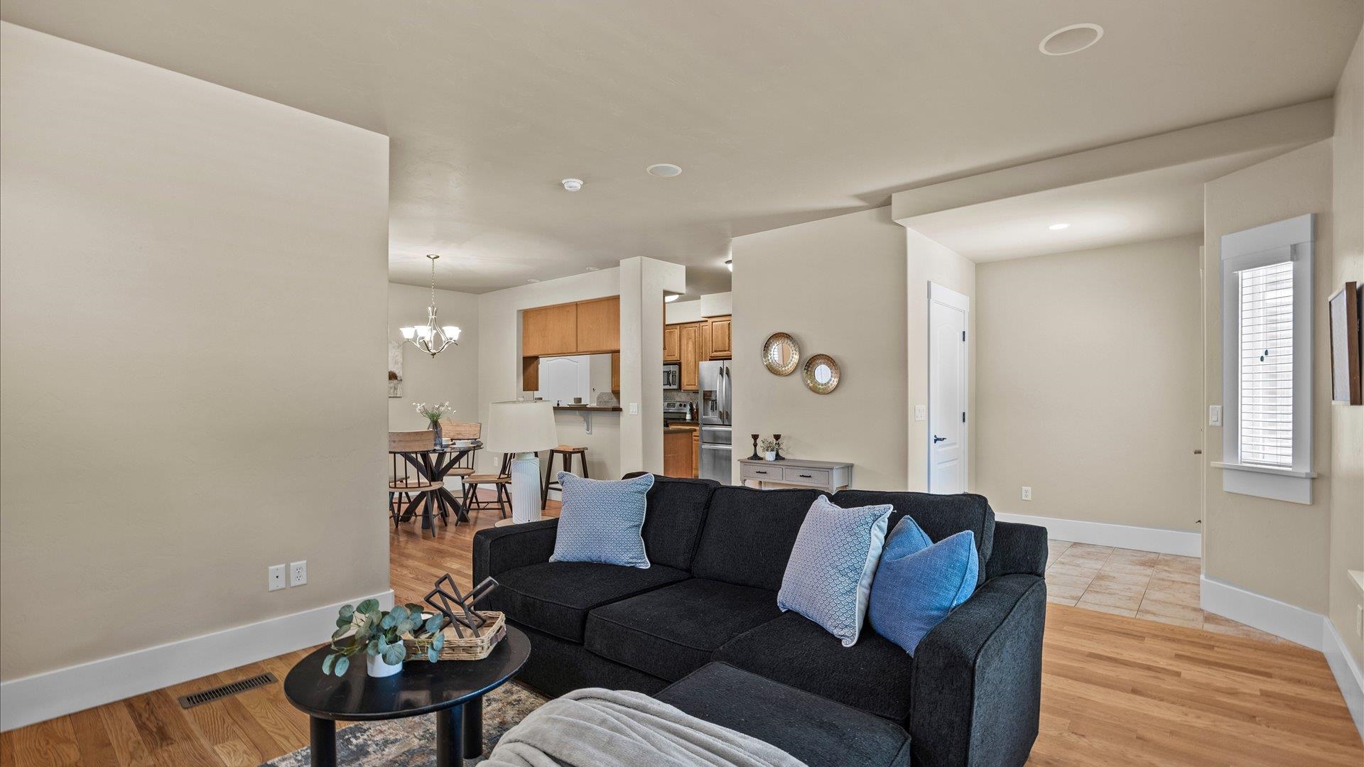 1115 Sunrose Lane Fruita, CO 81521 - Photo 3 of 32 a living room with furniture and wooden floor