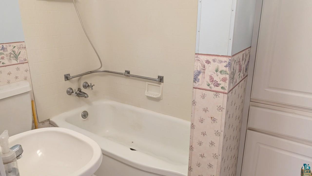 8159 Ludlow Road Cook, MN 55723 - Photo 19 of 32 Bathroom featuring shower / bath combination and a sink