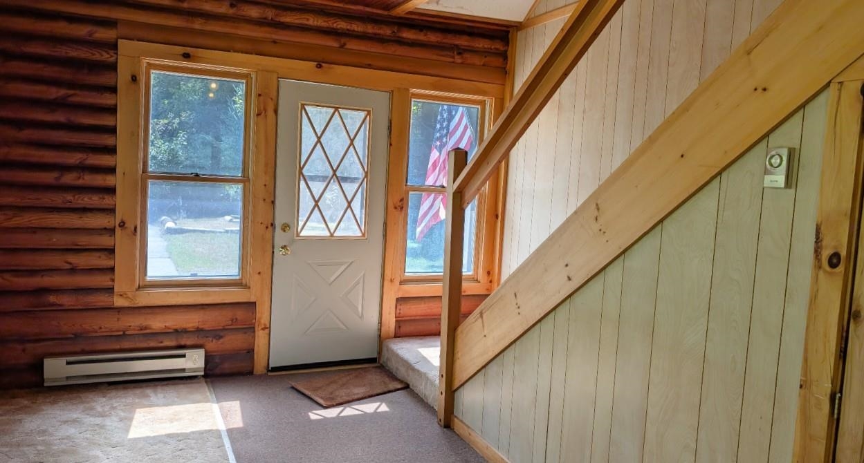 8159 Ludlow Road Cook, MN 55723 - Photo 10 of 32 Doorway featuring a baseboard heating unit and carpet floors