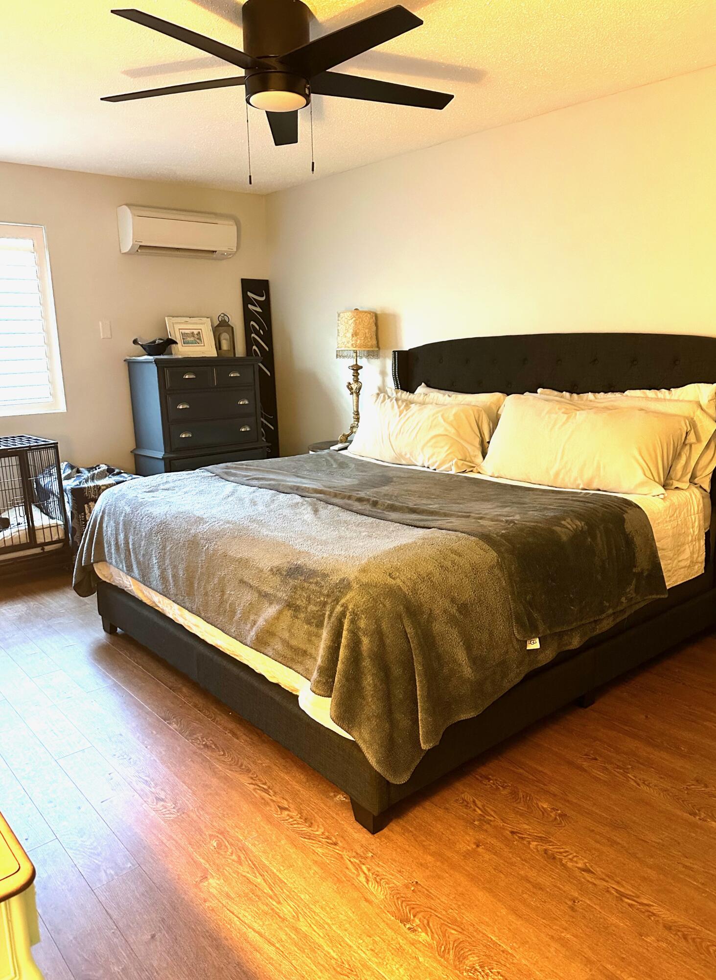 21 Round House Road Bourne, MA 02532 - Photo 11 of 21 a bedroom with a bed and wooden floor