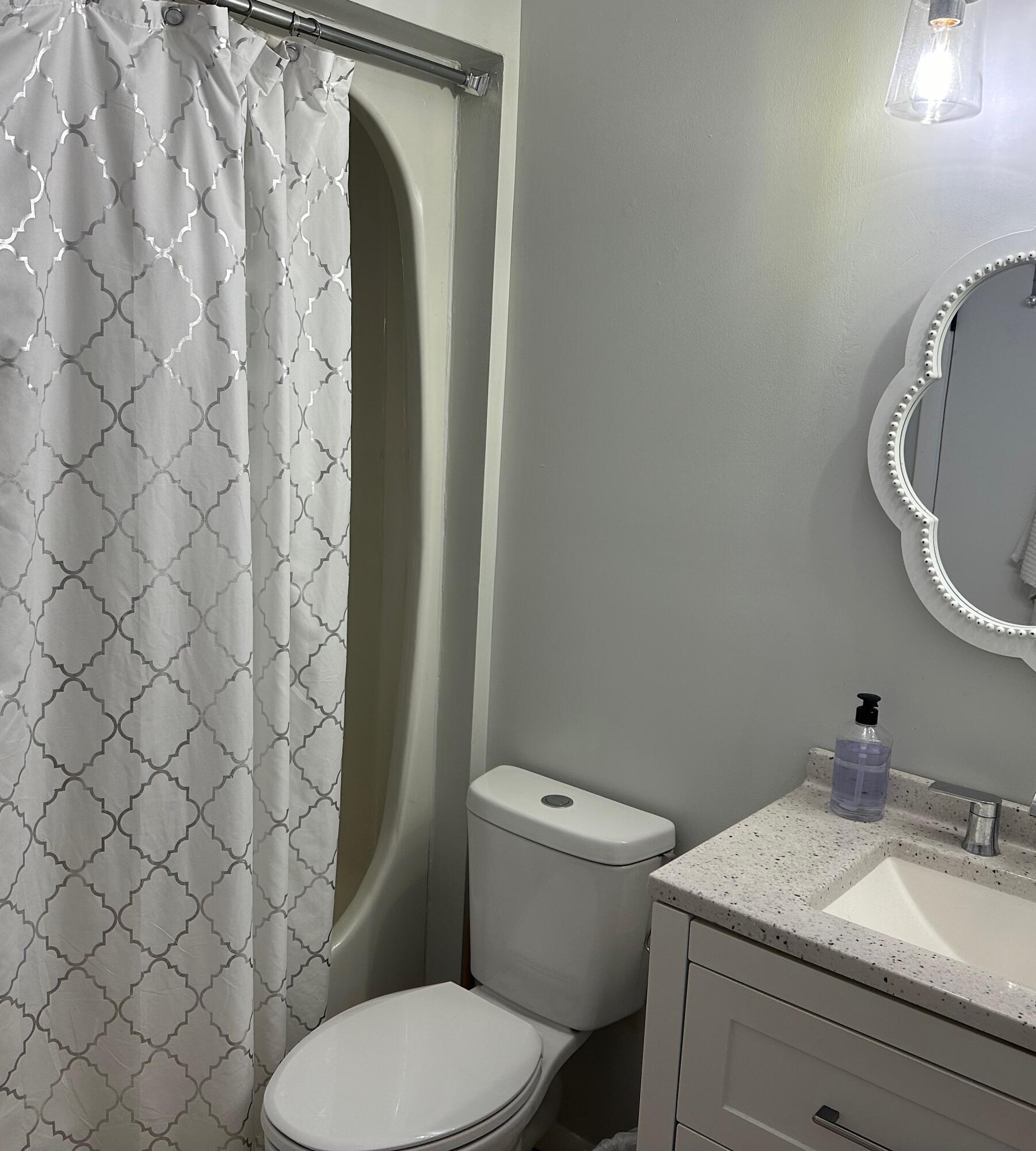 21 Round House Road Bourne, MA 02532 - Photo 14 of 21 a bathroom with a granite countertop toilet and a sink