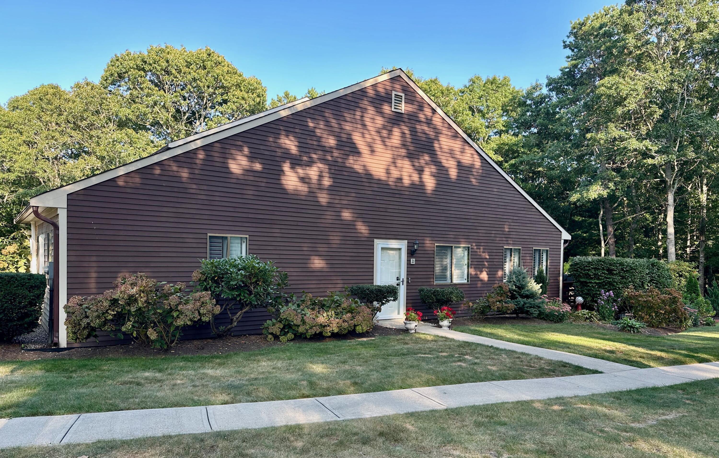 21 Round House Road Bourne, MA 02532 - Photo 2 of 21 a front view of a house with a yard