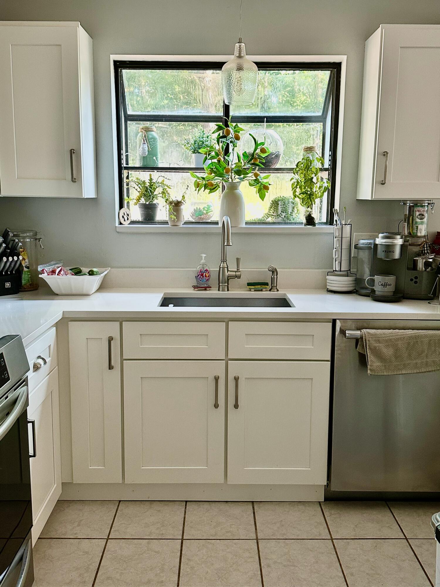 21 Round House Road Bourne, MA 02532 - Photo 8 of 21 a kitchen with a sink window and cabinets