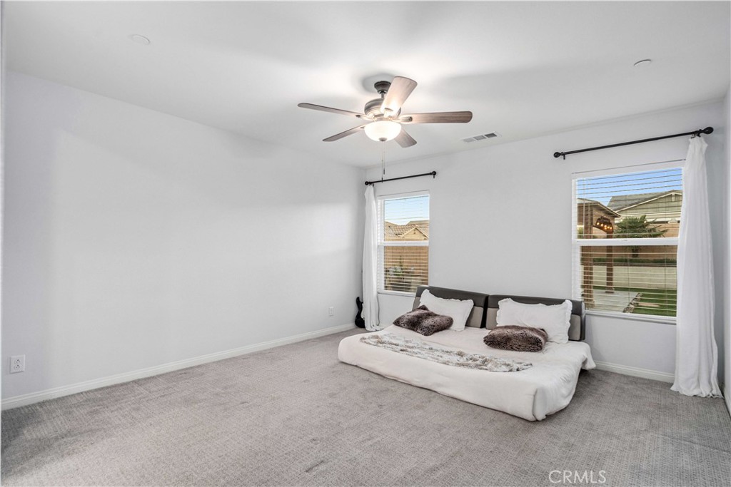 44451 63rd Street West Lancaster, CA 93536 - Photo 18 of 47 a living room with furniture and a chandelier