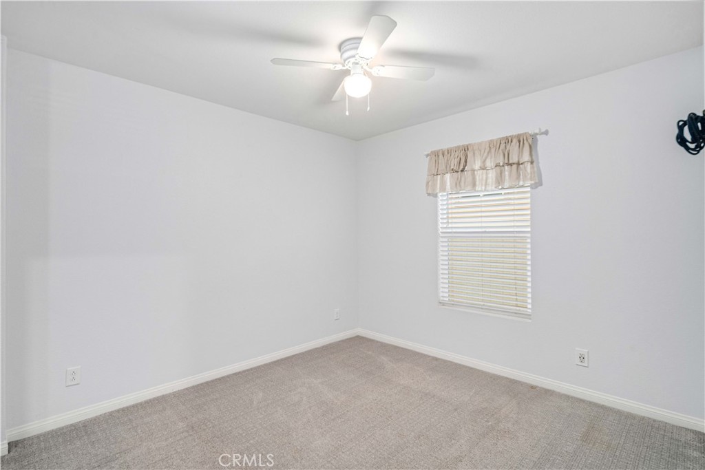 44451 63rd Street West Lancaster, CA 93536 - Photo 25 of 47 an empty room with windows and fan
